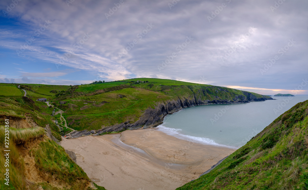 Evening light on the Ceredigion cliffs and Cardigan Island from Mwnt, Wales Evening light on the Ceredigion cliffs and Cardigan Island from Mwnt, Wales