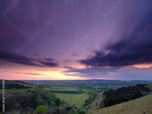 Summer sunset over Meon Valley towards Beacon Hill and Old Winchester Hill, South Downs National Park