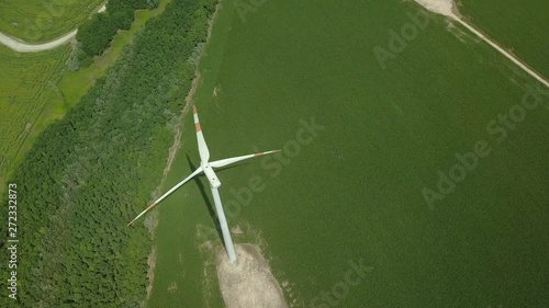 Wind tubine spinning, aerial drone footage photo