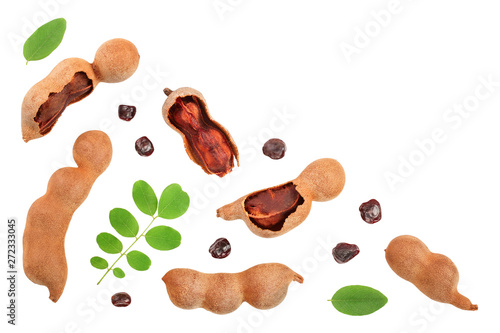 Tamarind fruit with leaf and seed isolated on white background with copy space for your text. Top view. Flat lay photo