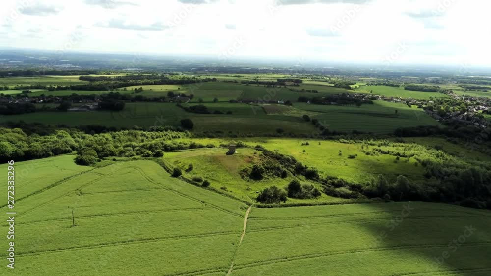 Ominous dark clouds casting shadows over aerial countryside agricultural landscape UK green scenic fields. Ominous dark clouds casting shadows over aerial countryside agricultural landscape UK green scenic fields.