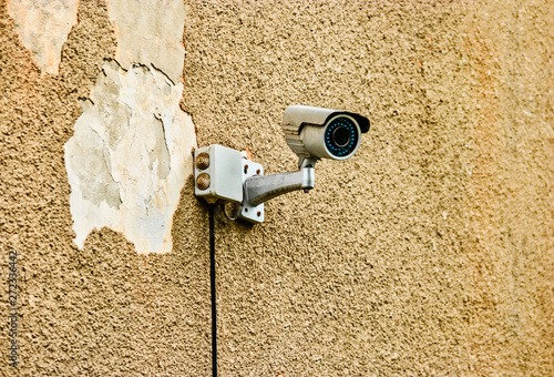 Security camera Private property protection on damaged wall