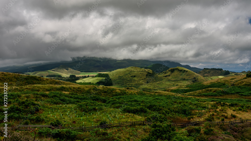 landscape in terceira, view of the green landscape in terceira during a cloudy day, azores, portugal.