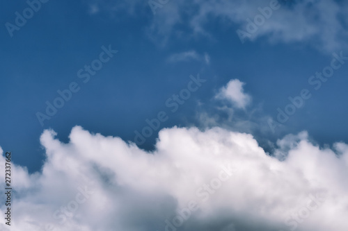 Blue sky background with white clouds. Beautiful nature wallpaper for background