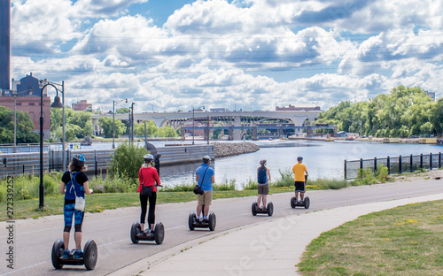 People are riding Segway along Mississippi River photo