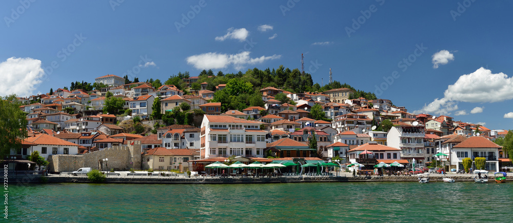 Ochrid, Macedonia: toursit walking and enjoing in the view of old part of Ochrid city on a boat dock on a Ochrid lake
