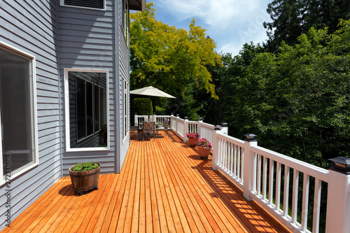 Brand new red cedar outdoor wooden patio during nice day photo