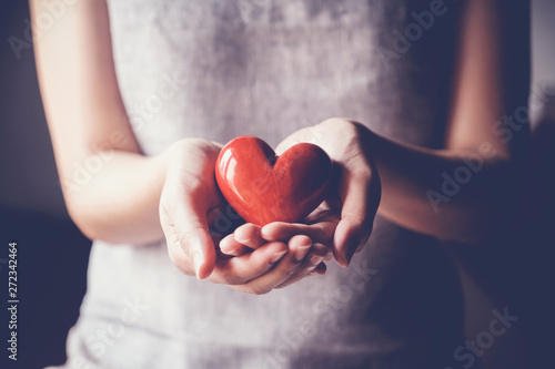 Fotobehang woman holding red heart, health insurance, donation charity concept, world healt