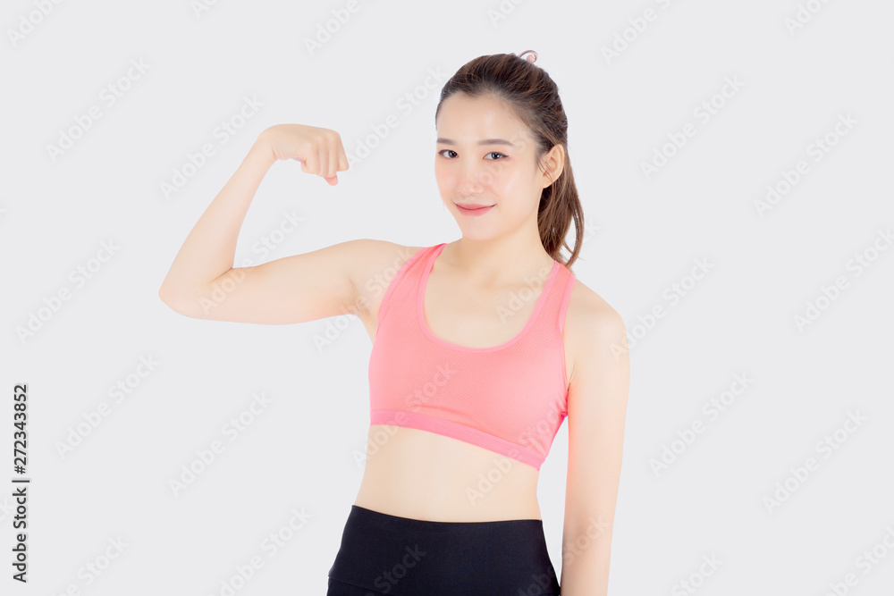 Beautiful portrait young asian woman wear sport clothes have strong and muscle with health, girl show biceps with workout for wellness isolated on white background, strength and fit concept.