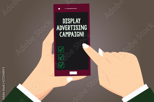 Word writing text Display Advertising Campaign. Business concept for conveys a commercial message using graphics Hu analysis Hands Holding Pointing Touching Smartphone Blank Color Screen