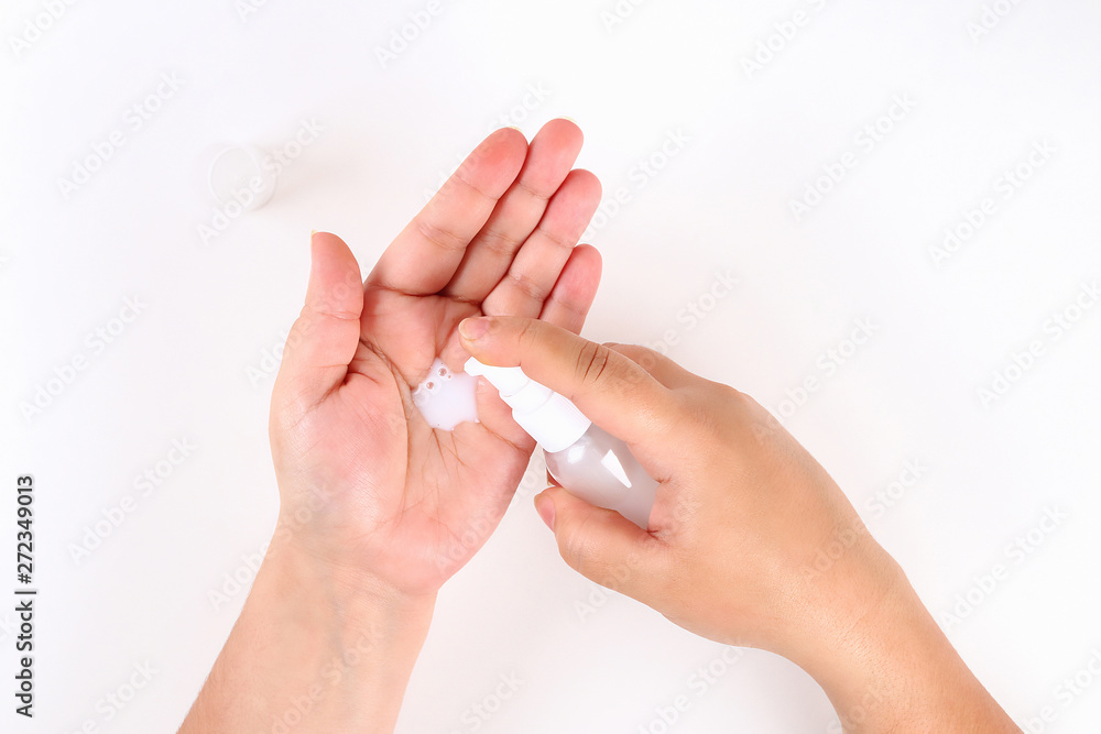 Girl uses hand cream on white background. Top view. Girl uses hand cream on white background. Top view.