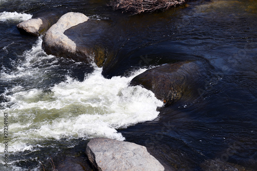 water flowing down a rock