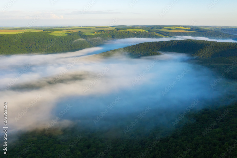 Canyon river in fog shooting from the air Canyon river in fog shooting from the air