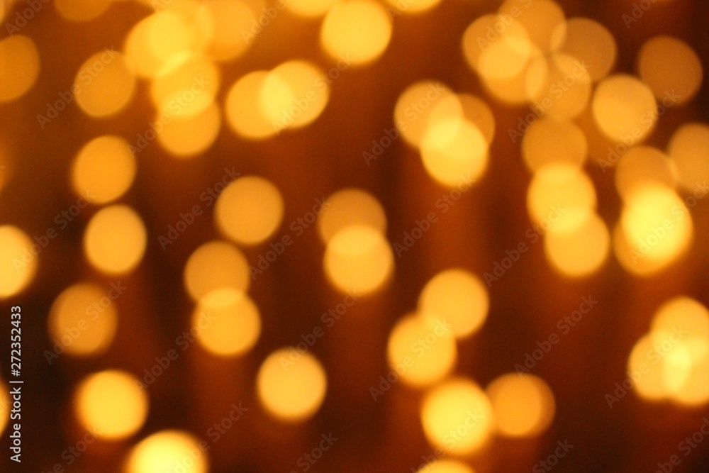 Fototapeta premium Many candles illuminate in the dark, filmed as blurred