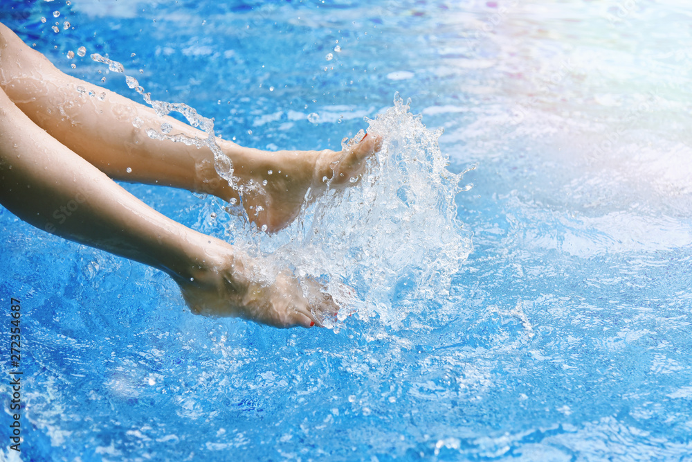 Enjoy beautiful girl relaxing in swimming pool, Happy girl splashing water in summer.