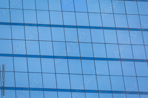 Blue glass windows of office building