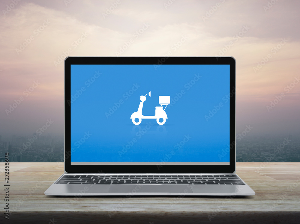 Motorcycle flat icon with modern laptop computer on wooden table over office city tower and skyscraper at sunset sky, vintage style, Business delivery service online concept Motorcycle flat icon with modern laptop computer on wooden table over office city tower and skyscraper at sunset sky, vintage style, Business delivery service online concept