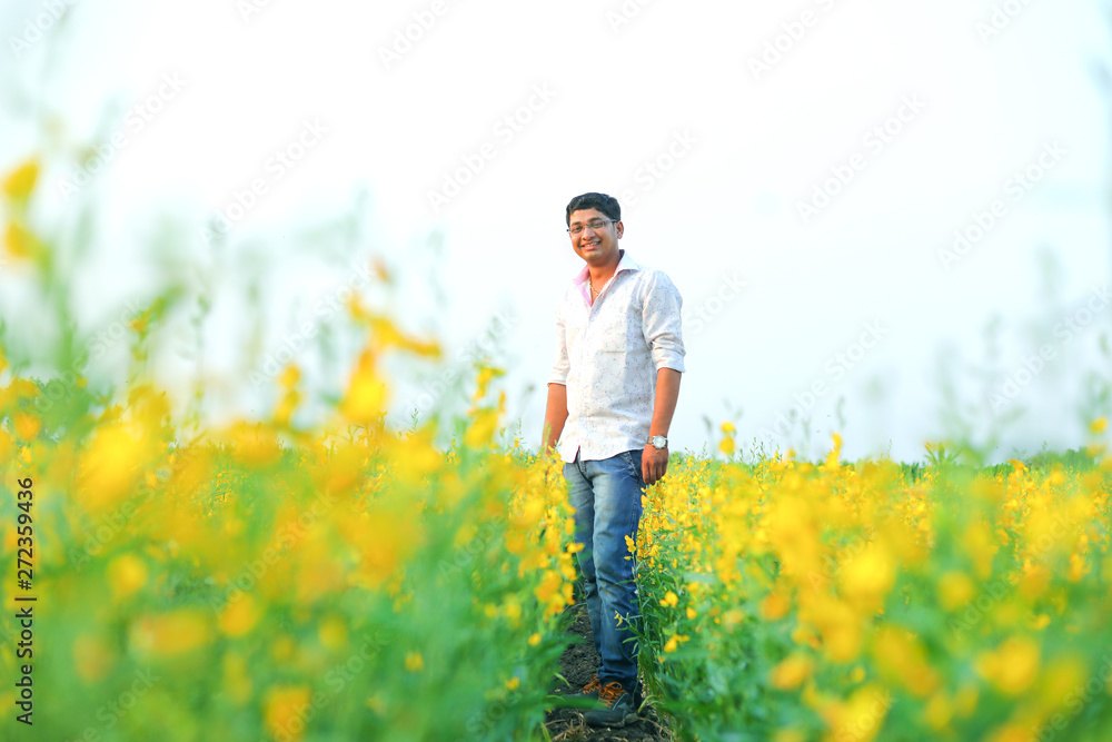 Young indian farmer at field