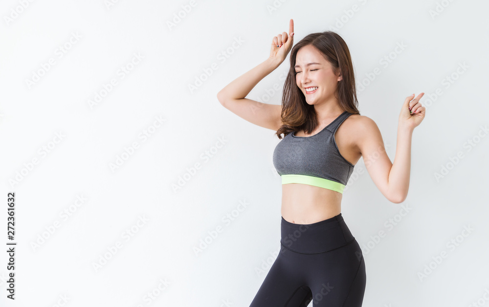 Portrait of healthy asian woman body curve with sport wear copy space on  white background. People beauty perfect body slim fit fitness girl happy  and relaxing. Freedom lifestyle concept Stock Photo