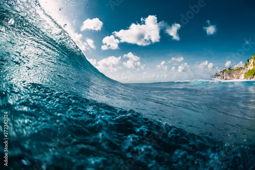 Crashing ocean blue wave. Breaking barrel wave