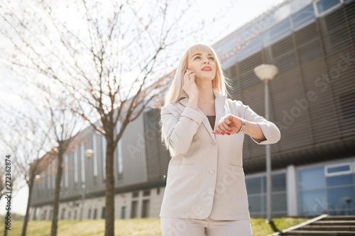 Portrait of a young girl holding a mobile phone.