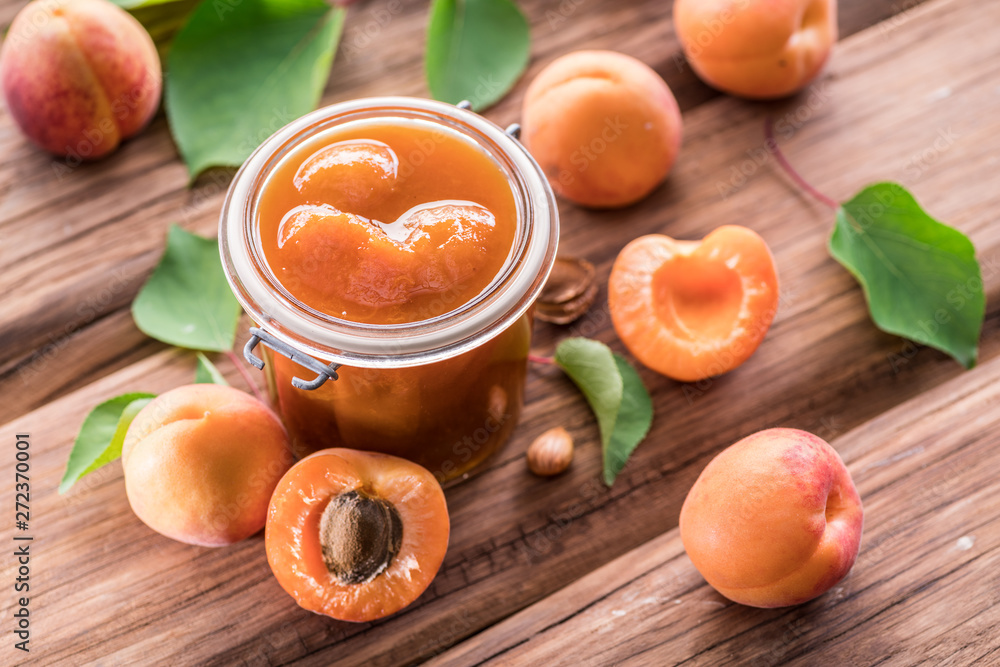 Apricot jam and ripe apricots on the table. Apricot jam and ripe apricots on the table.
