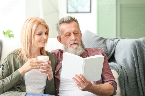 Happy elderly couple restin...