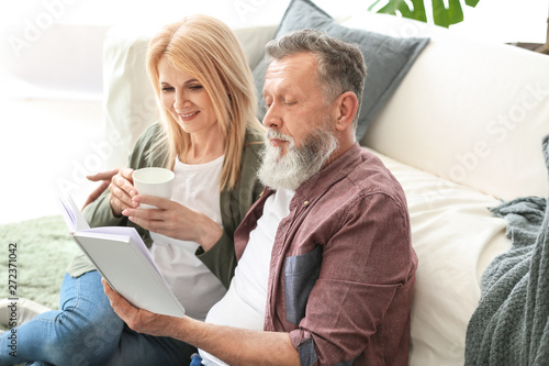 Happy elderly couple restin...
