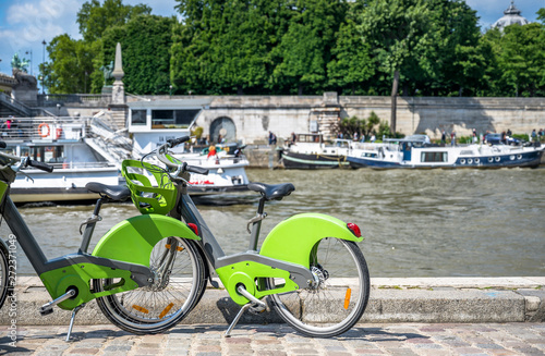 Electric rental bikes stands on the bank of the Seine in Paris ready for bike ride