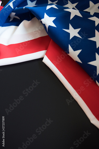 American flag close up in dark background with copy space