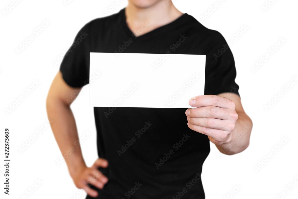 A man holding a white sheet of paper. Holding a booklet. Close up. Isolated on white background A man holding a white sheet of paper. Holding a booklet. Close up. Isolated on white background