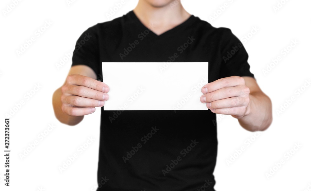 A man holding a white sheet of paper. Holding a booklet. Close up. Isolated on white background A man holding a white sheet of paper. Holding a booklet. Close up. Isolated on white background