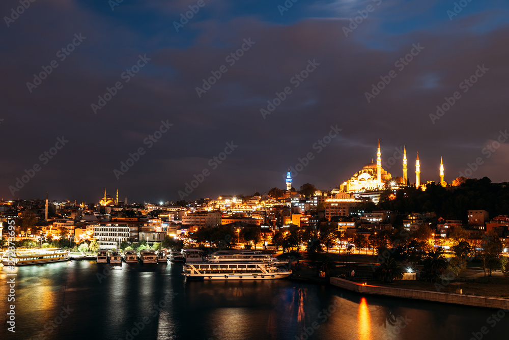 Night city Istanbul. Istanbul night landscape. Night view of the city. Galata Tower, Galata Bridge, Karakoy district and Golden Horn at night.