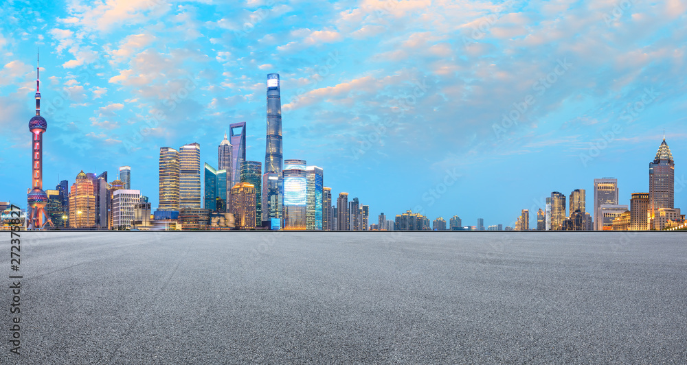 Asphalt race track ground and modern skyline and buildings in Shanghai at night,panoramic view Asphalt race track ground and modern skyline and buildings in Shanghai at night,panoramic view