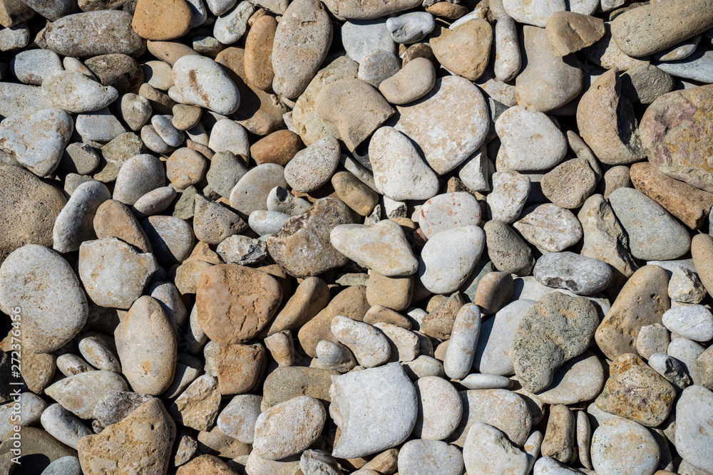 Background of sea pebbles. Limestone rocks on the shores of the Gulf of Finland. Background of sea pebbles. Limestone rocks on the shores of the Gulf of Finland.