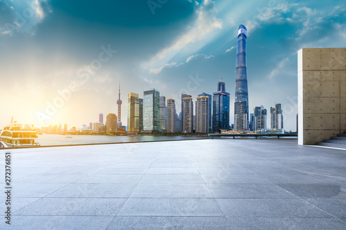 Shanghai skyline and modern city skyscrapers with empty floor at sunset,China © ABCDstock