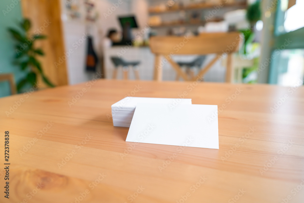 Blank business cards on wooden surface Blank business cards on wooden surface