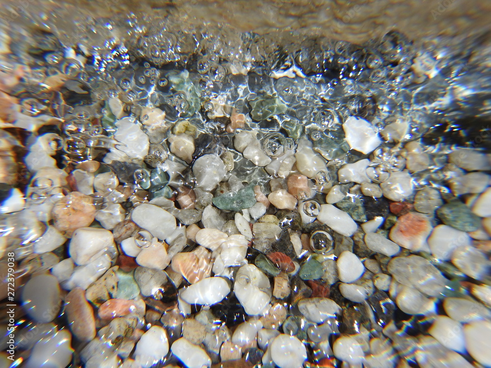 Fototapeta premium Colorful stones under water. Texture.