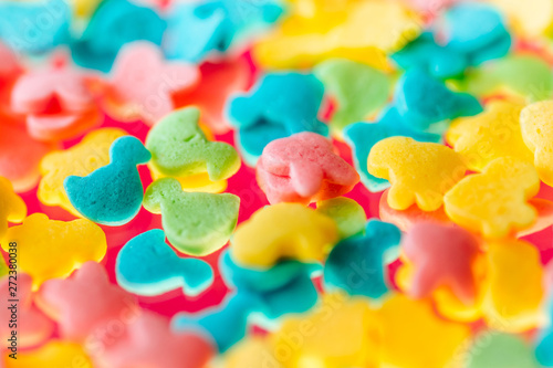 multicolored candy on a yellow background 