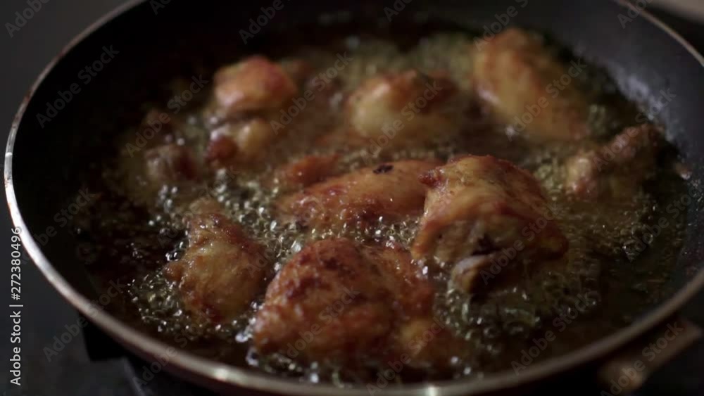 frying chicken in hot oil frying chicken in hot oil