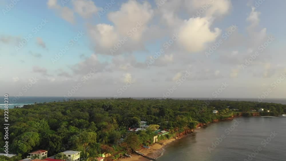 Aerial Ascend/Pan Left: Island Village Houses On Shore Of Ocean - Little Corn Island, Nicaragua Aerial Ascend/Pan Left: Island Village Houses On Shore Of Ocean - Little Corn Island, Nicaragua