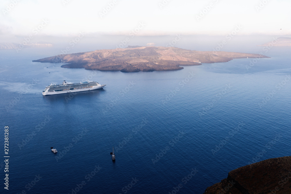 Picturesque view of the city of Santorini. White buildings, sea, mountains. Romantic vacation by the sea