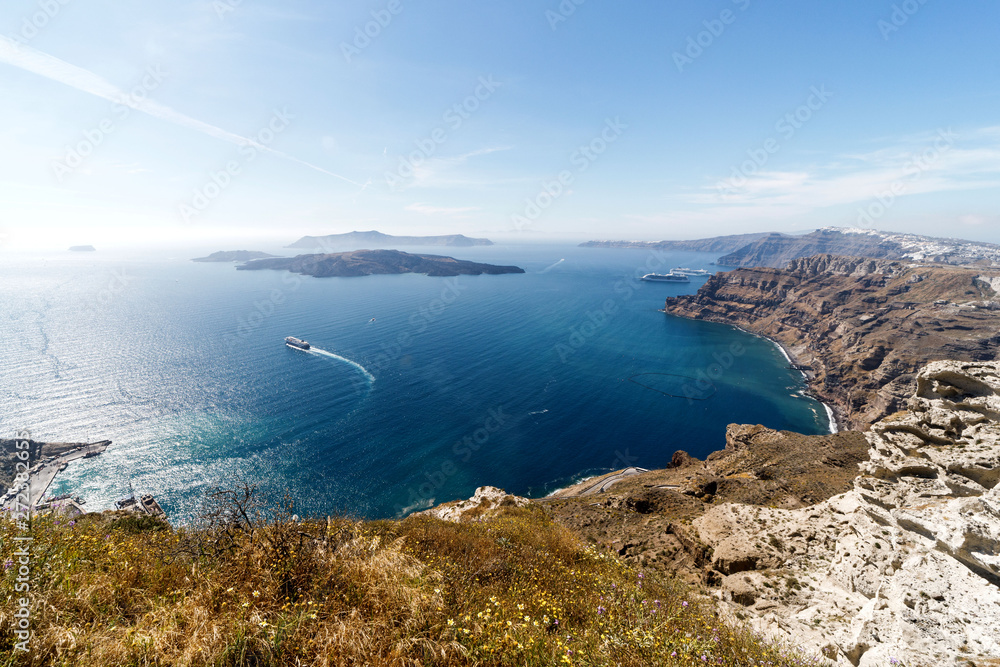 Picturesque view of the city of Santorini. White buildings, sea, mountains. Romantic vacation by the sea Picturesque view of the city of Santorini. White buildings, sea, mountains. Romantic vacation by the sea