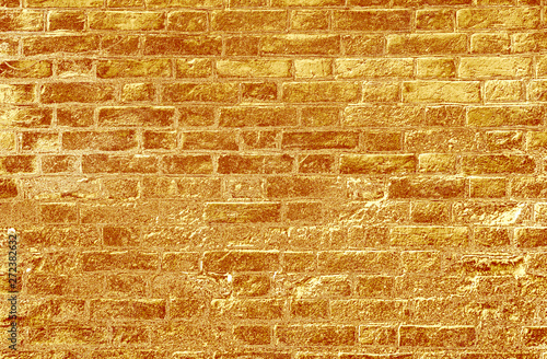 Yellow gold brick wall abstract texture background