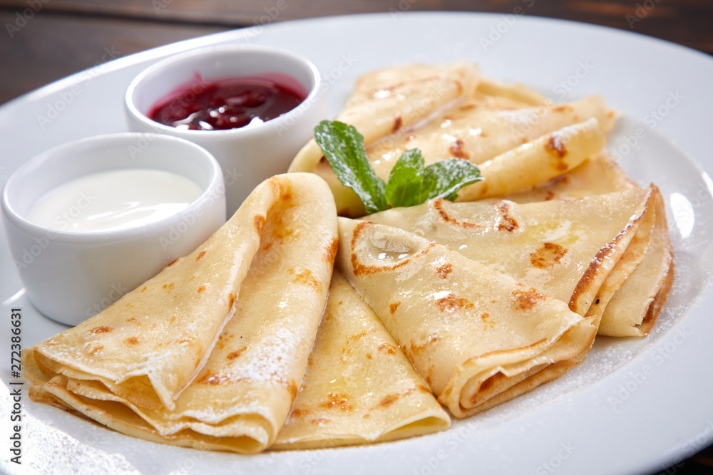 pancakes with sour cream and berry sauce pancakes with sour cream and berry sauce