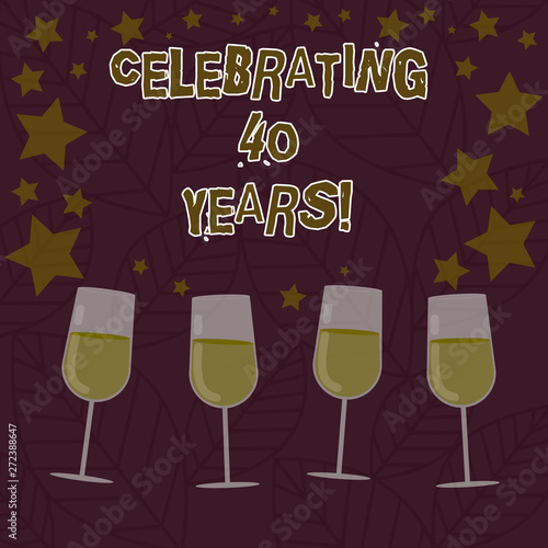 Conceptual hand writing showing Celebrating 40 Years. Business photo text Honoring Ruby Jubilee Commemorating a special day Filled Cocktail Wine with Scattered Stars Confetti Stemware