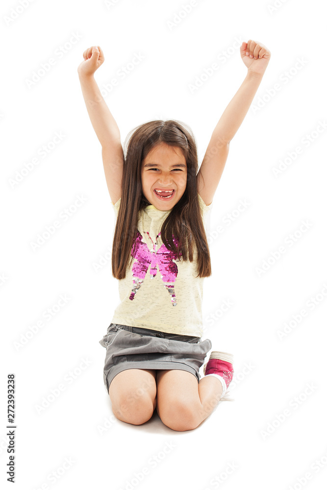 Portrait of screaming little girl with raised hands up. Isolated on white background