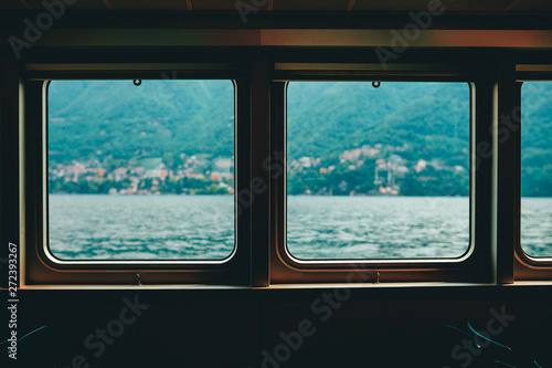 View from the ferry through the Windows to the mountains and lake