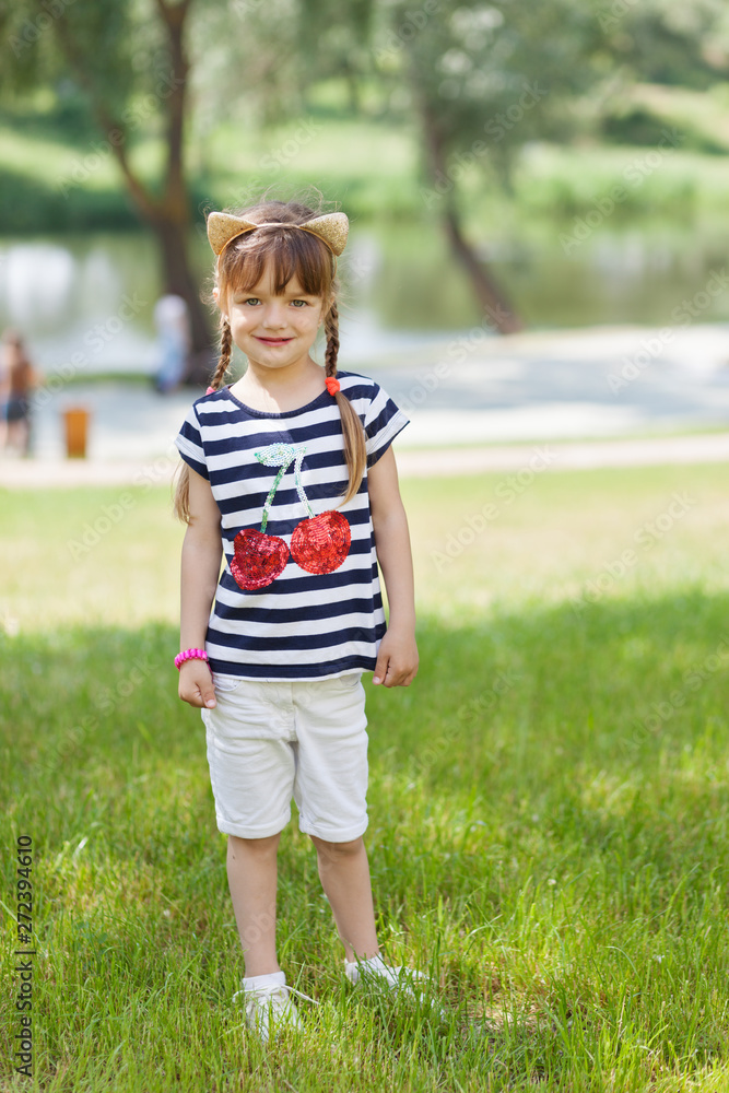 Young girl posing outdoors