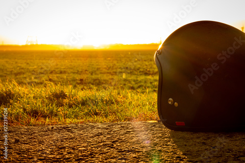 Motorcycle helmet in the sun on the ground